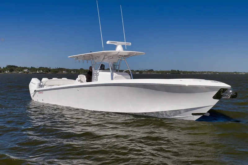 Bahama 41 Yacht Photos Pics 2024 Bahama 41 RD boat cruising on open water under clear blue sky.