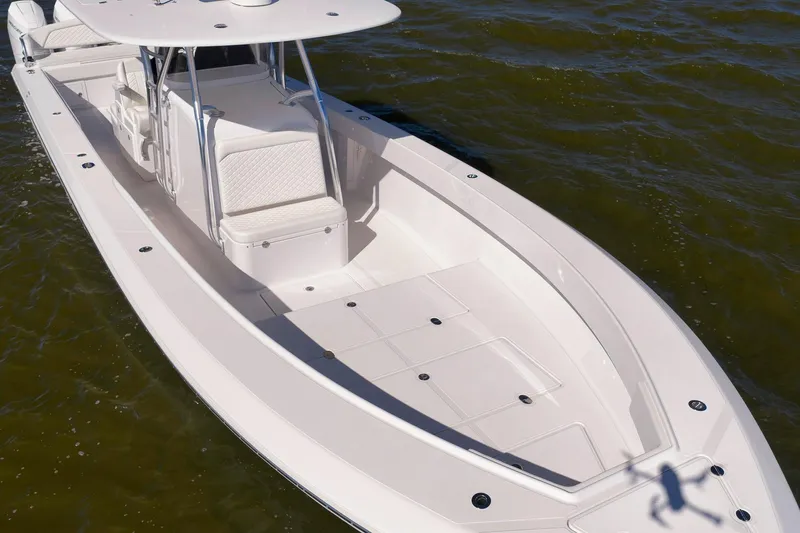 Bahama 41 Yacht Photos Pics 2024 Bahama 41 RD boat on water, showcasing spacious deck and seating.