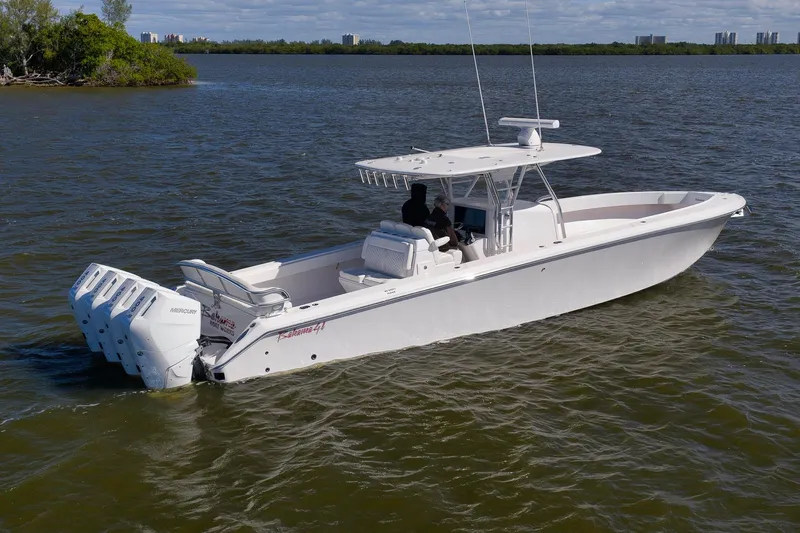 Bahama 41 Yacht Photos Pics 2024 Bahama 41 RD boat cruising on a calm lake with four outboard engines.