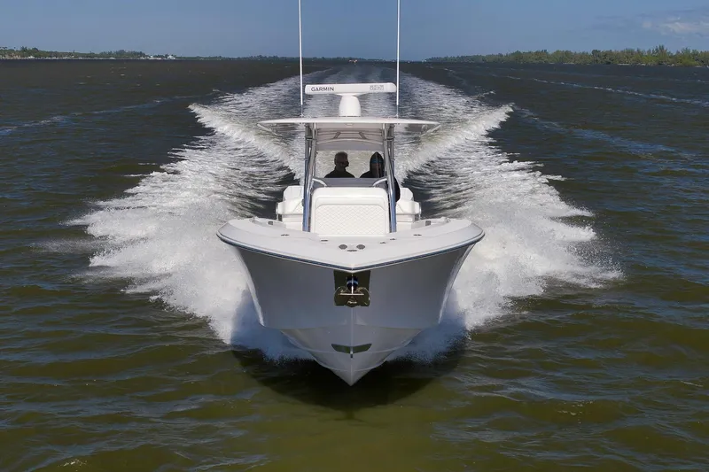 Bahama 41 Yacht Photos Pics 2024 Bahama 41 RD boat cruising on open water, creating a dynamic wake.