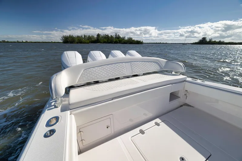 Bahama 41 Yacht Photos Pics 2024 Bahama 41 RD boat with luxurious seating, cruising on a sunny day.