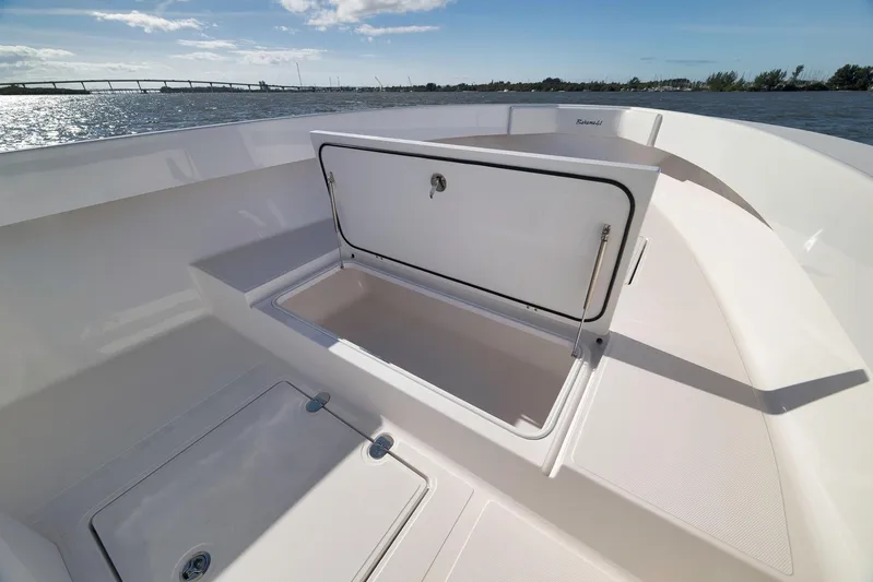Bahama 41 Yacht Photos Pics 2024 Bahama 41 RD boat with open storage compartment on deck, scenic water view.