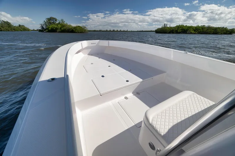 Bahama 41 Yacht Photos Pics 2024 Bahama 41 RD boat on calm water, featuring spacious deck and seating.