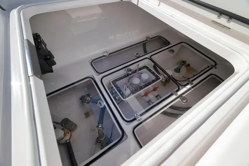 Bahama 41 Yacht Photos Pics 2024 Bahama 41 RD boat storage compartment with visible plumbing and wiring components.