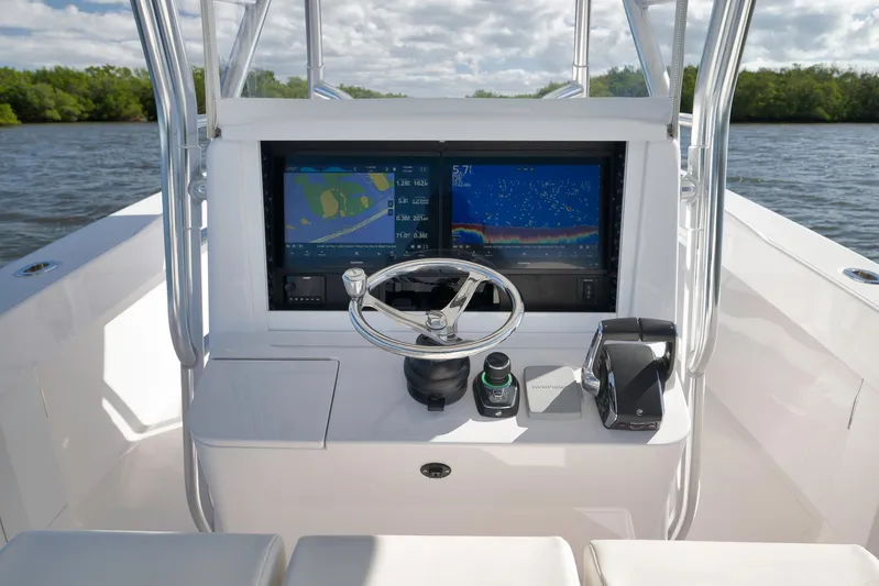 Bahama 41 Yacht Photos Pics 2024 Bahama 41 RD boat helm with dual navigation screens and steering wheel.