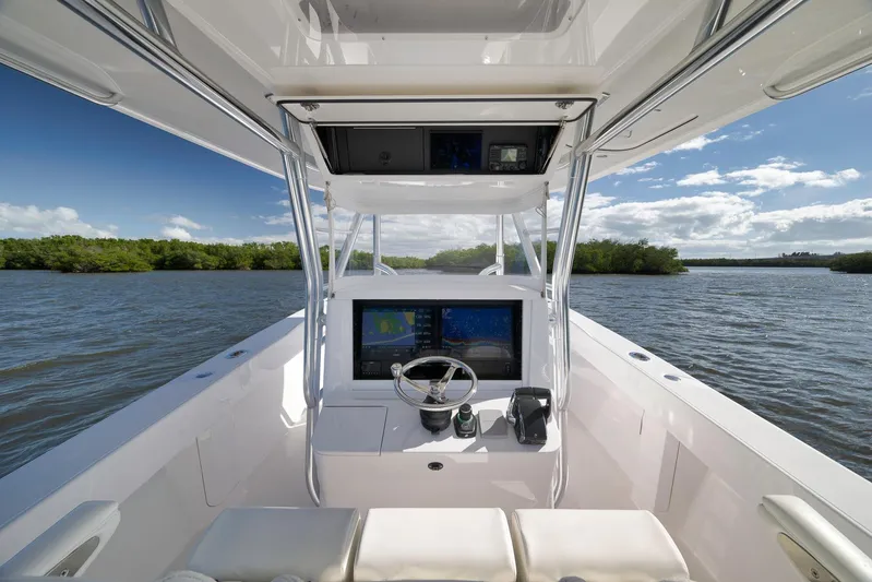 Bahama 41 Yacht Photos Pics 2024 Bahama 41 RD boat cockpit with advanced navigation system on a sunny day.