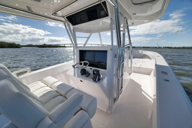 Bahama 41 Yacht Photos Pics 2024 Bahama 41 RD boat interior with sleek helm and luxurious seating on open water.