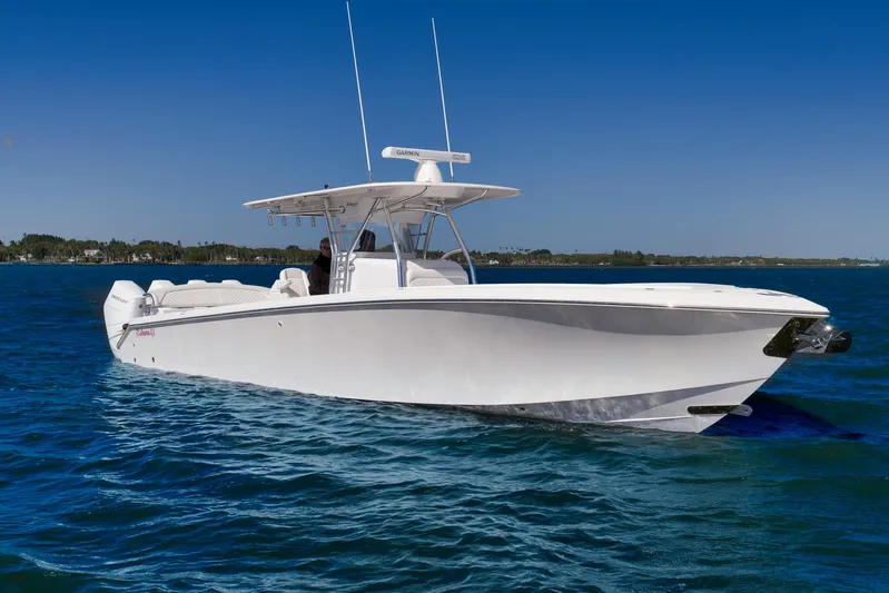 Bahama 41 Yacht Photos Pics 2024 Bahama 41 RD boat cruising on clear blue water under a sunny sky.