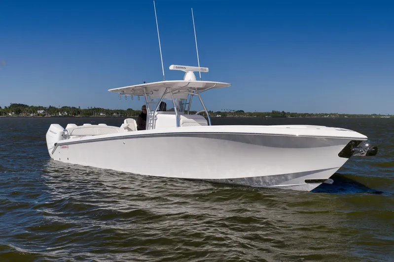 Bahama 41 Yacht Photos Pics 2024 Bahama 41 RD boat cruising on open water under clear blue sky.