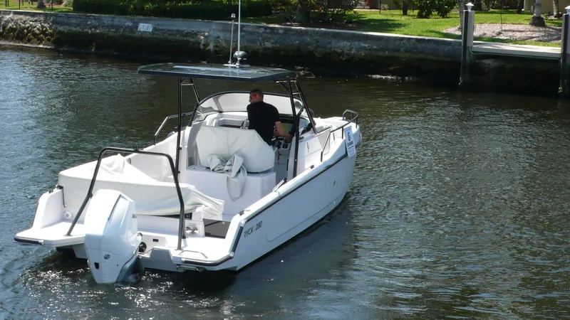  Yacht Photos Pics 2023 RYCK 28 boat cruising on a calm waterway.