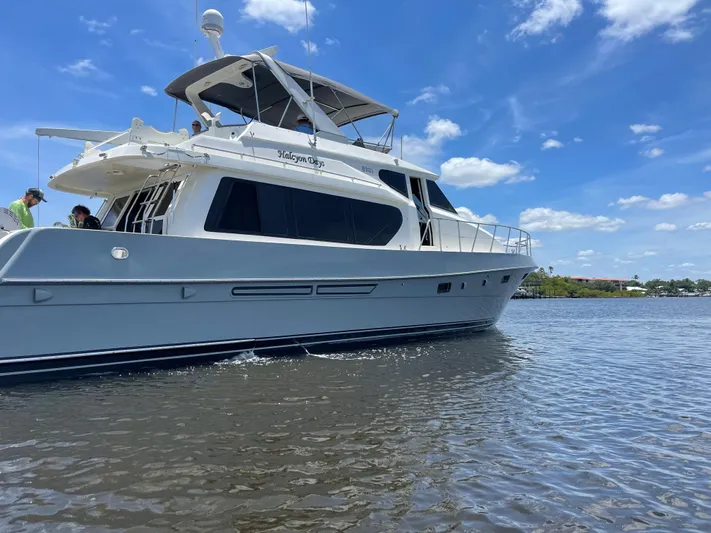 Baby Girl Yacht Photos Pics 1999 McKinna 57 Pilothouse yacht cruising on a sunny day with blue skies.