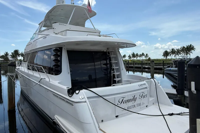  Yacht Photos Pics 2002 Carver 570 Voyager Pilothouse yacht docked, "Family Ties" from Houston, Texas.