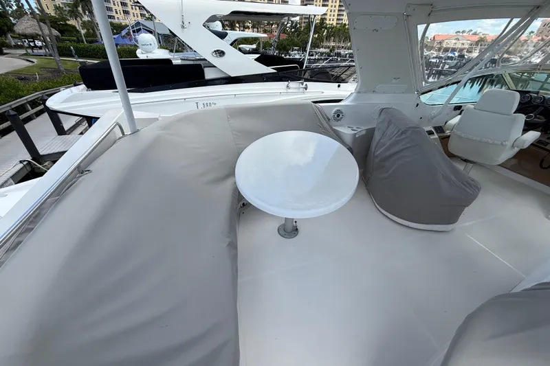  Yacht Photos Pics 2002 Carver 570 Voyager Pilothouse yacht interior with seating and table on deck.