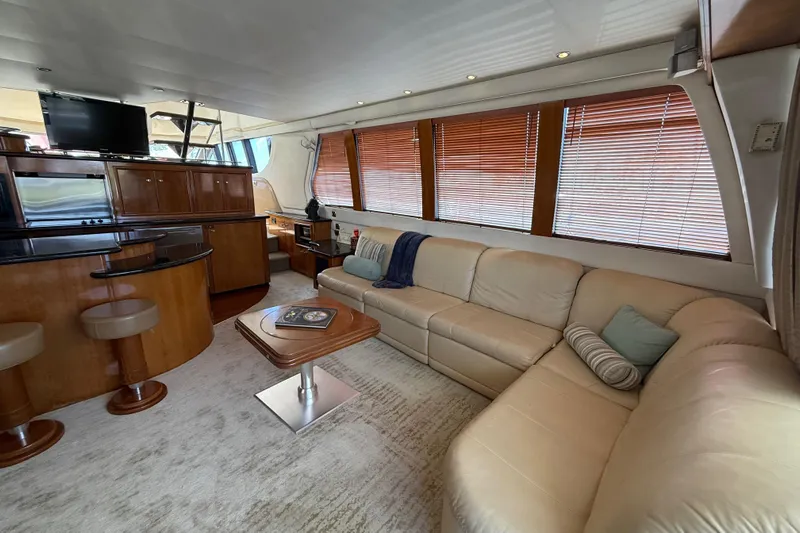  Yacht Photos Pics Luxurious interior of 2002 Carver 570 Voyager Pilothouse with leather seating and modern amenities.