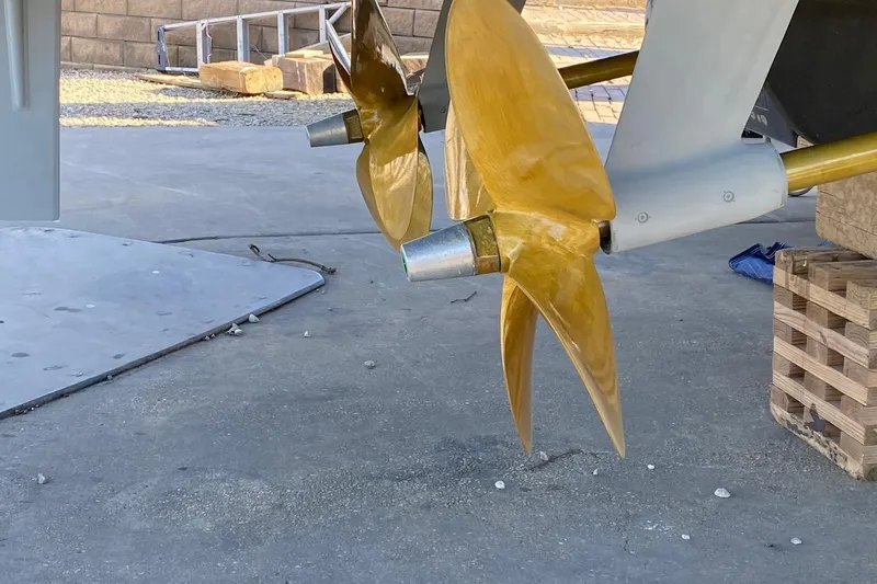 Sparrow Yacht Photos Pics Golden propeller of a 2014 Azimut Magellano 50 yacht on dry dock.