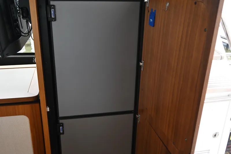 Sparrow Yacht Photos Pics Interior view of 2014 Azimut Magellano 50 yacht, featuring a sleek, modern refrigerator.