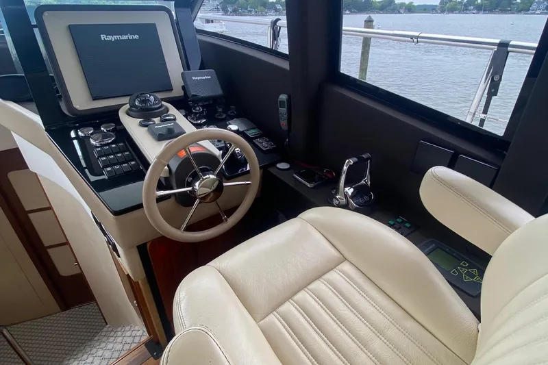 Sparrow Yacht Photos Pics 2014 Azimut Magellano 50 yacht helm with Raymarine navigation system and leather seating.
