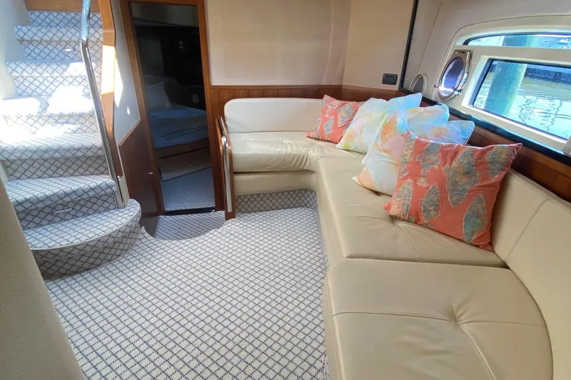 Sparrow Yacht Photos Pics Luxurious interior of 2014 Azimut Magellano 50 yacht with plush seating and vibrant cushions.