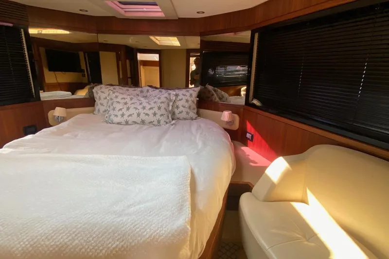 Sparrow Yacht Photos Pics Luxurious bedroom interior of 2014 Azimut Magellano 50 yacht with elegant furnishings.