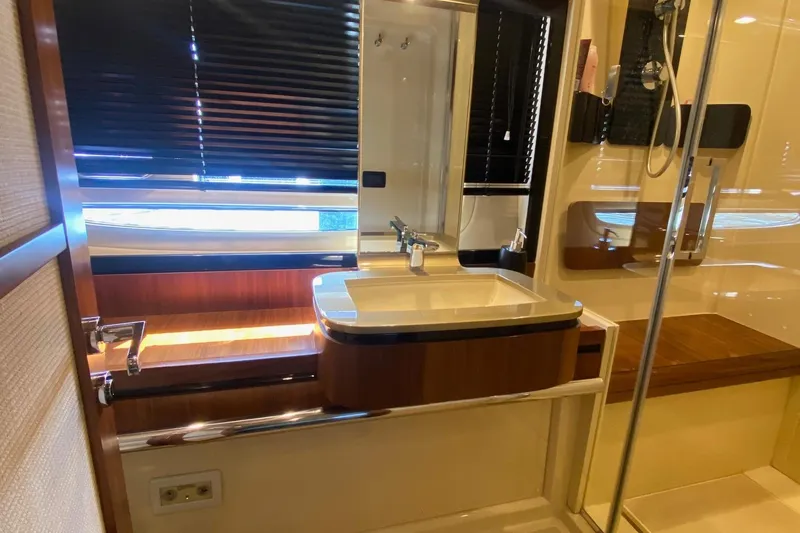 Sparrow Yacht Photos Pics Luxurious bathroom interior of 2014 Azimut Magellano 50 yacht with modern fixtures.