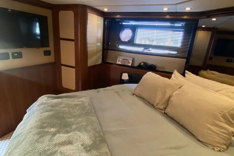 Sparrow Yacht Photos Pics Luxurious bedroom interior of 2014 Azimut Magellano 50 yacht with cozy bedding and modern decor.