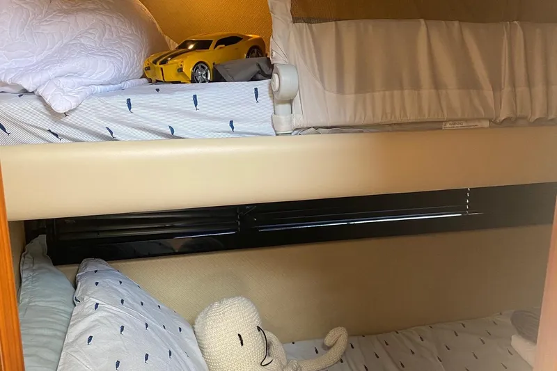 Sparrow Yacht Photos Pics Bunk beds in 2014 Azimut Magellano 50 yacht cabin with toy car and plush toy.
