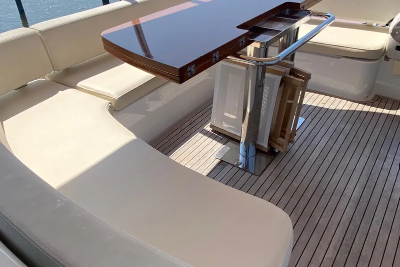 Sparrow Yacht Photos Pics Luxurious seating area on 2014 Azimut Magellano 50 yacht with wooden table.