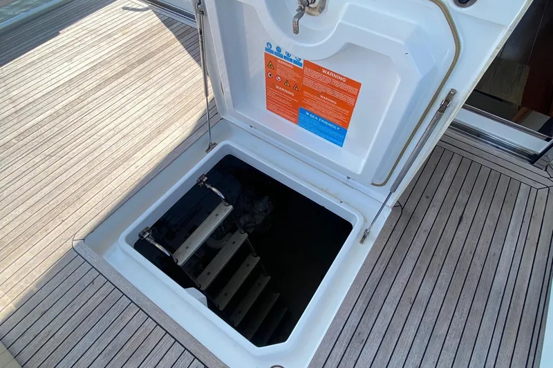 Sparrow Yacht Photos Pics Open hatch on 2014 Azimut Magellano 50 yacht deck, revealing interior access.
