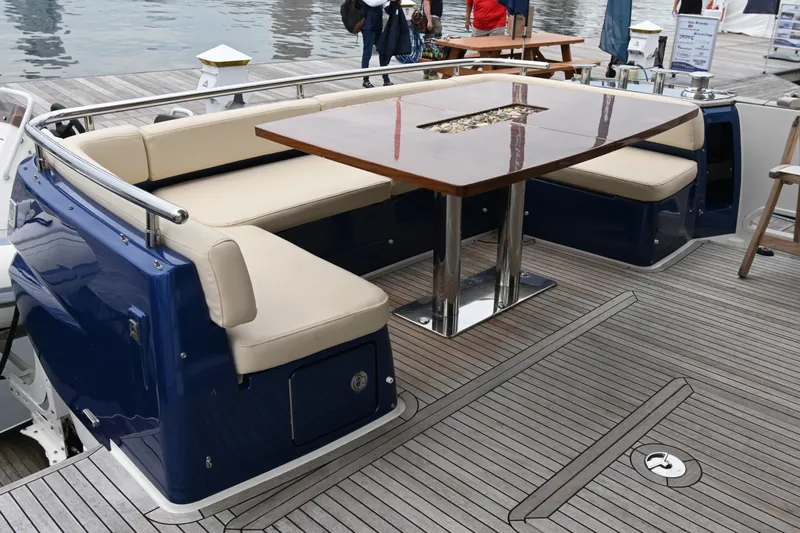 Sparrow Yacht Photos Pics Luxury seating area on 2014 Azimut Magellano 50 yacht with elegant wooden table.