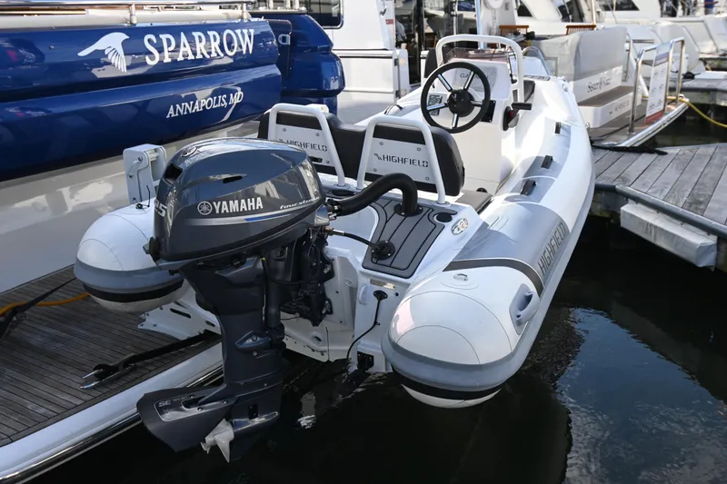 Sparrow Yacht Photos Pics Highfield inflatable boat with Yamaha outboard motor docked beside Azimut Magellano 50, 2014 model.