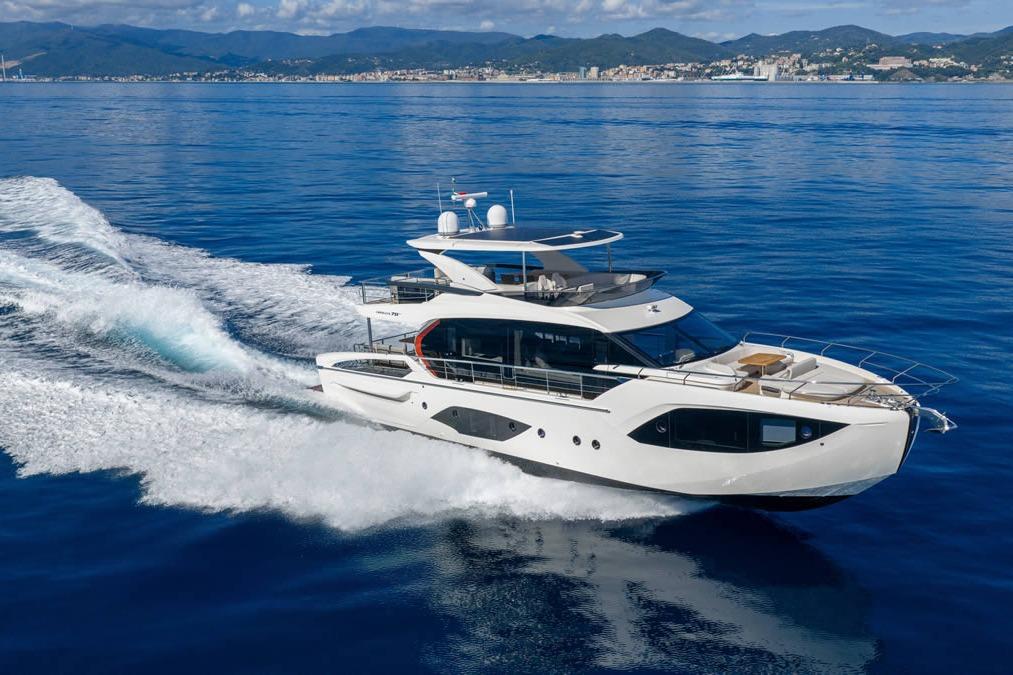 Luxury Absolute 70' Fly yacht cruising on open sea, 2026 model.