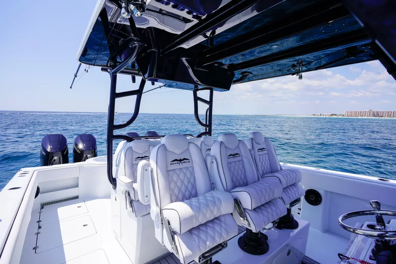  Yacht Photos Pics 2026 Invincible 40 Catamaran interior with luxurious seating on open water.