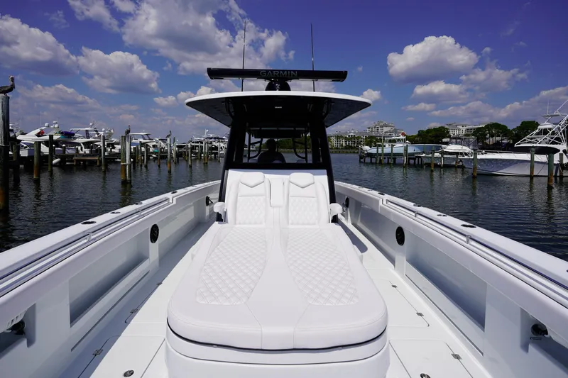  Yacht Photos Pics 2026 Invincible 40 Catamaran docked, featuring sleek design and luxurious seating.