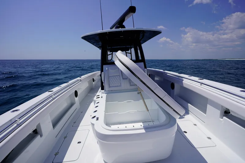  Yacht Photos Pics 2026 Invincible 40 Catamaran on open sea, featuring spacious deck and storage.