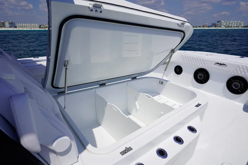  Yacht Photos Pics Open storage compartment on 2026 Invincible 40 Catamaran, featuring sleek design and ocean backdrop.