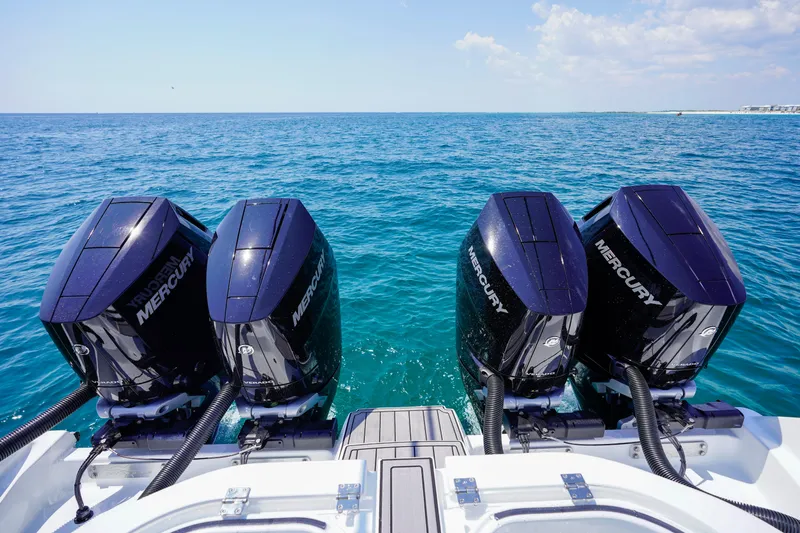  Yacht Photos Pics 2026 Invincible 40 Catamaran with four Mercury outboard engines on open sea.