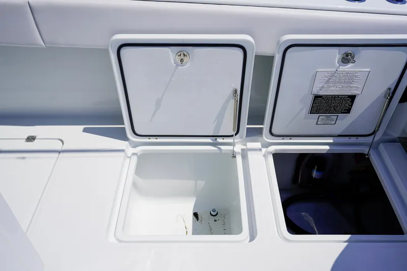  Yacht Photos Pics Open storage compartments on a 2026 Invincible 40 Catamaran boat deck.