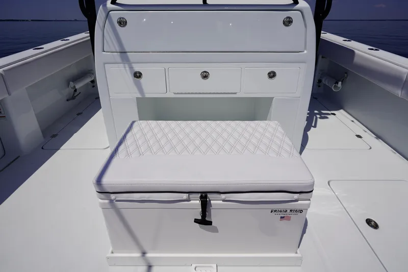  Yacht Photos Pics 2026 Invincible 40 Catamaran interior with cushioned seating and storage drawers.