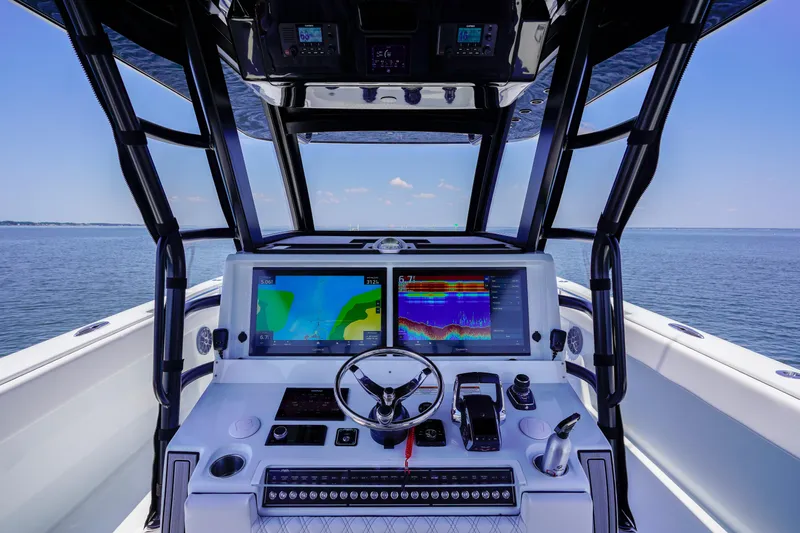  Yacht Photos Pics Helm of 2026 Invincible 40 Catamaran with advanced navigation systems on open water.