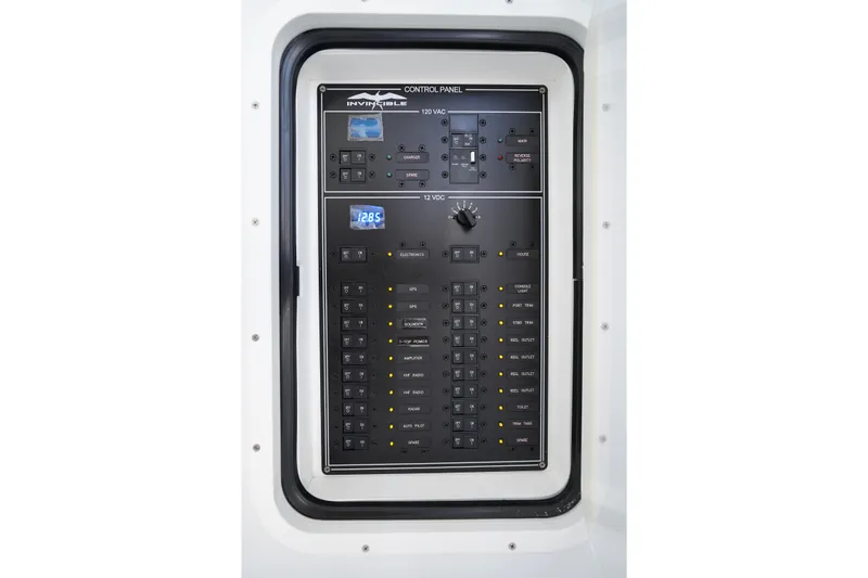  Yacht Photos Pics Control panel of 2026 Invincible 40 Catamaran, featuring various switches and indicators.