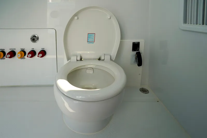  Yacht Photos Pics Toilet on 2026 Invincible 40 Catamaran with control panel and key.
