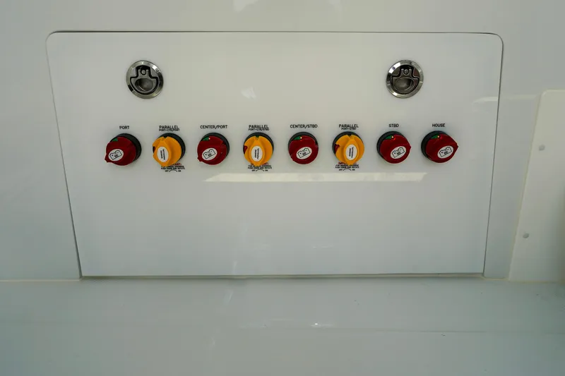  Yacht Photos Pics Control panel of 2026 Invincible 40 Catamaran with labeled switches and locks.