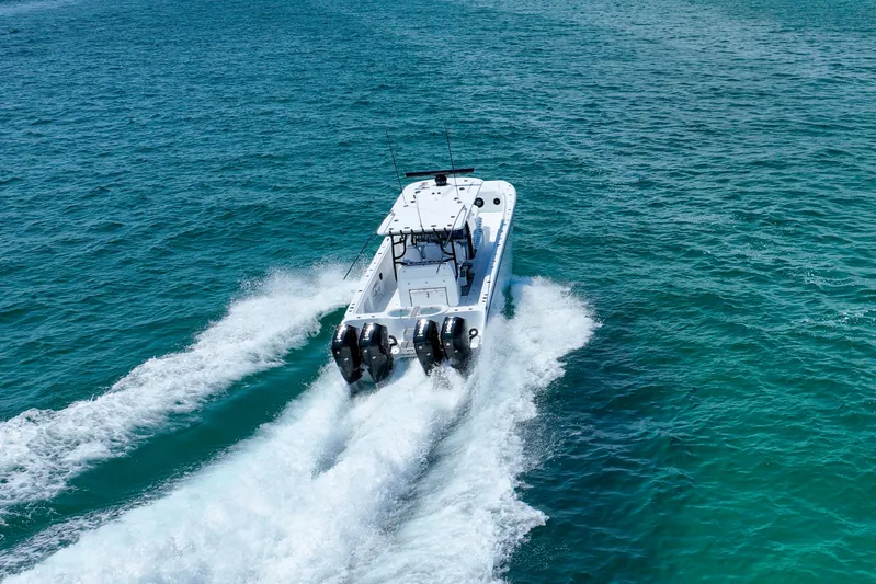  Yacht Photos Pics 2026 Invincible 40 Catamaran cruising on open blue water.