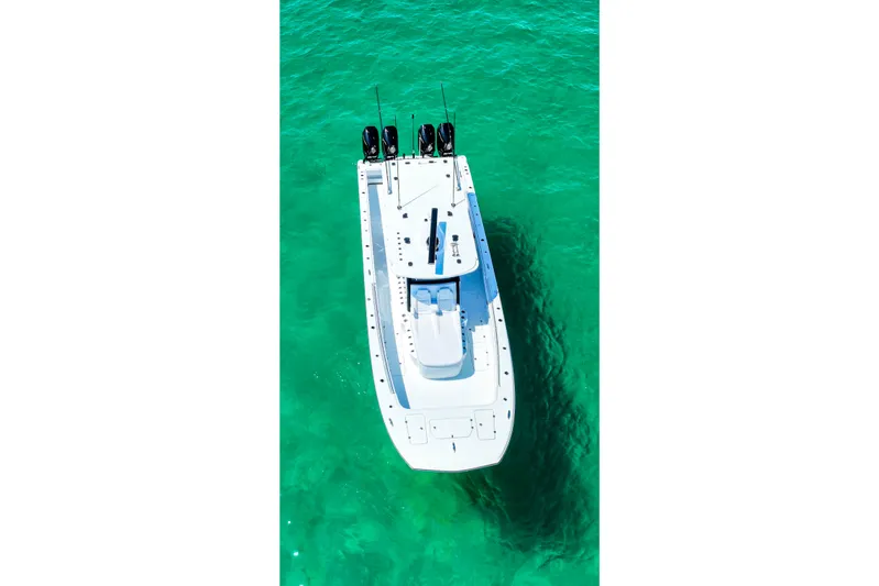  Yacht Photos Pics Aerial view of 2026 Invincible 40 Catamaran on clear turquoise water.