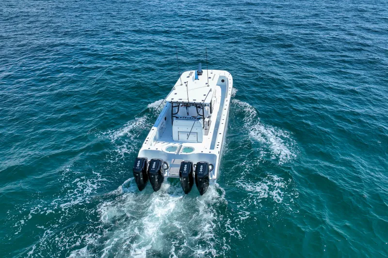  Yacht Photos Pics 2026 Invincible 40 Catamaran cruising on open blue ocean waters.