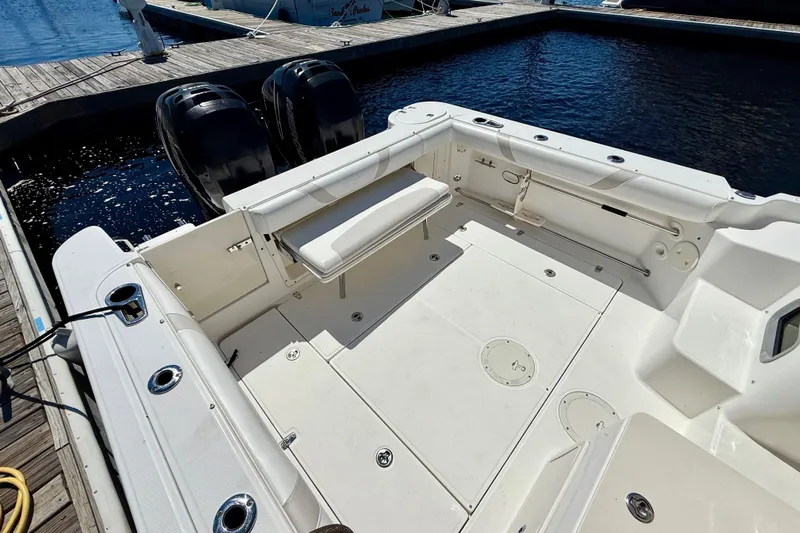  Yacht Photos Pics 2007 Boston Whaler 285 Conquest boat deck with twin engines at marina.