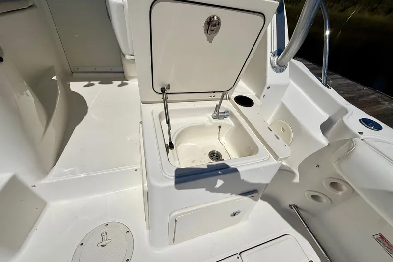  Yacht Photos Pics 2007 Boston Whaler 285 Conquest boat interior with open storage compartment.