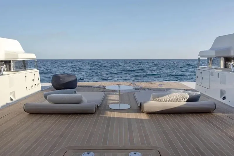  Yacht Photos Pics Luxurious deck of 2025 Bluegame BG74 yacht with ocean view and comfortable seating.