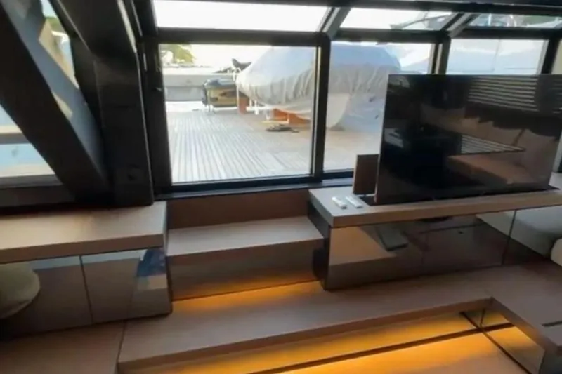  Yacht Photos Pics Luxurious interior of 2025 Bluegame BG74 yacht with modern TV and sleek design.