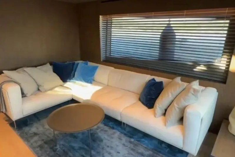  Yacht Photos Pics Luxurious interior of 2025 Bluegame BG74 yacht with plush white sectional sofa.